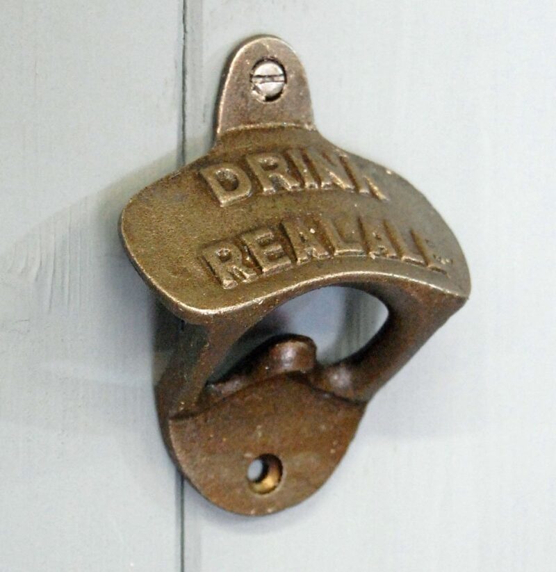 Antique style cast iron wall mounted bottle opener embossed Drink Real Ale