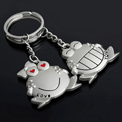 Silver frog couple keyring with heart eyes and smiling faces, labeled "LOVE" and "YOU" – a romantic keychain gift for couples
