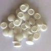 Pile of white silicone rubber end caps used for sealing and protecting pipes, tubes, fittings, or bolts