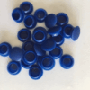 Collection of blue silicone rubber end caps used for sealing and protecting tubes, pipes, bolts, or threaded components
