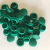 Collection of green silicone rubber end caps used to protect and seal pipe ends, tubes, and threaded components
