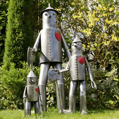 Wizard of Oz Tin Man Garden Statues in Multiple Sizes on Lawn with Trees
